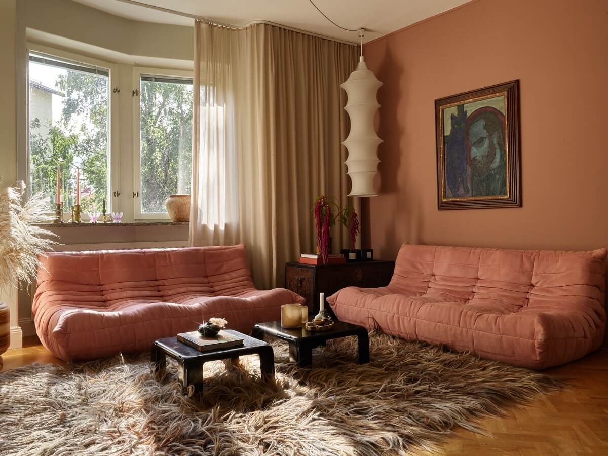 Warm Pink Tones in A Stockholm Apartment 3 pink-color-accents-large-rug-living-room-nordroom