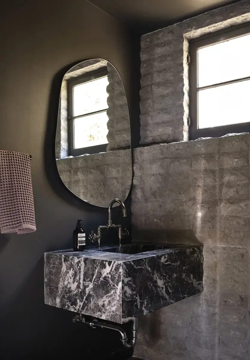 A Renovated Spanish Style Home in Hollywood Hills 22 powder-room-small-marble-sink-nordroom