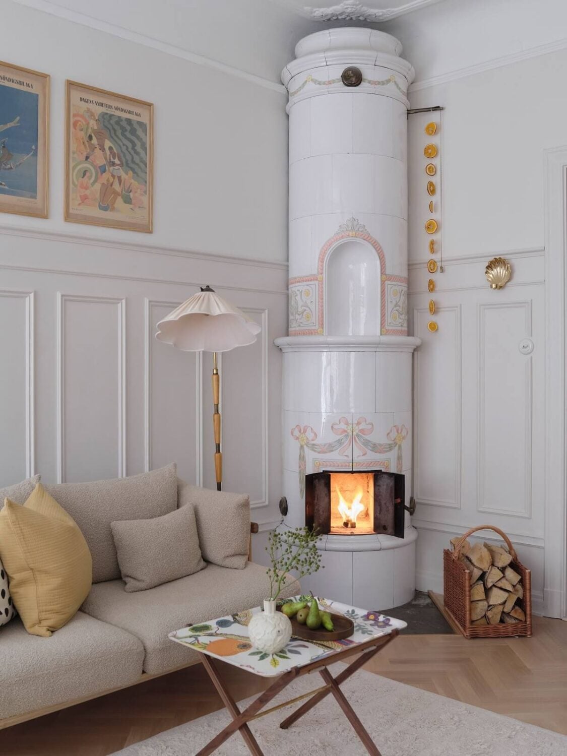 A Light Scandinavian Apartment with Classic Touches 5 round-tiled-fireplace-nordroom