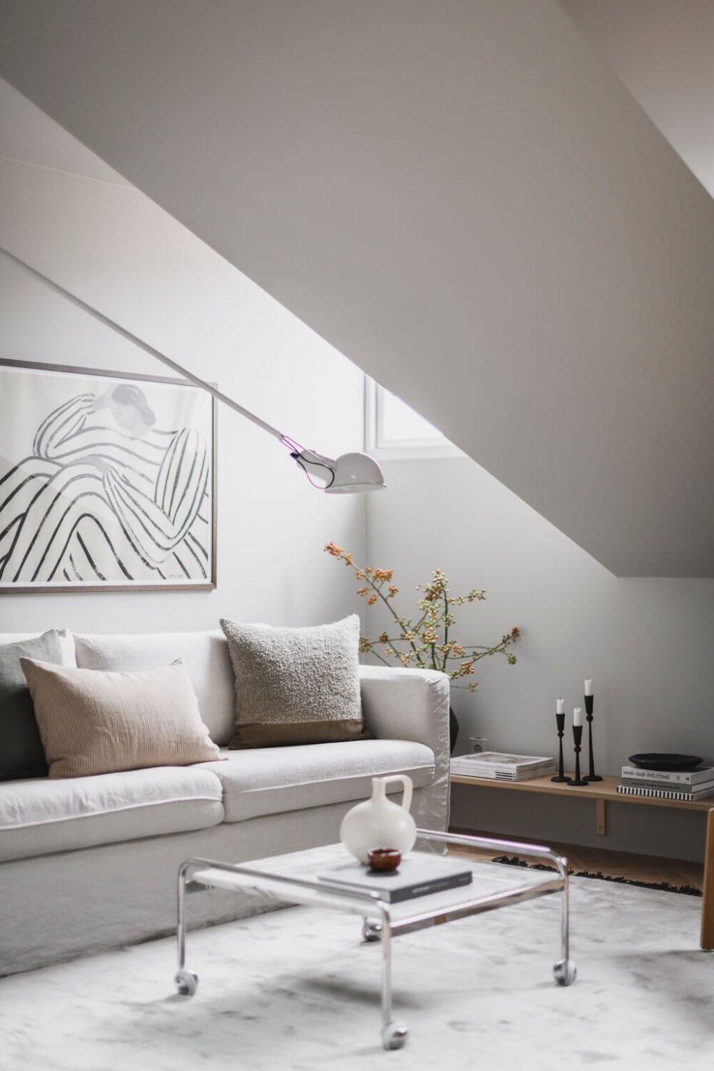 A Stylish Modern Gray Attic Apartment 2 scandinavian-living-room-slanted-ceiling-nordroom