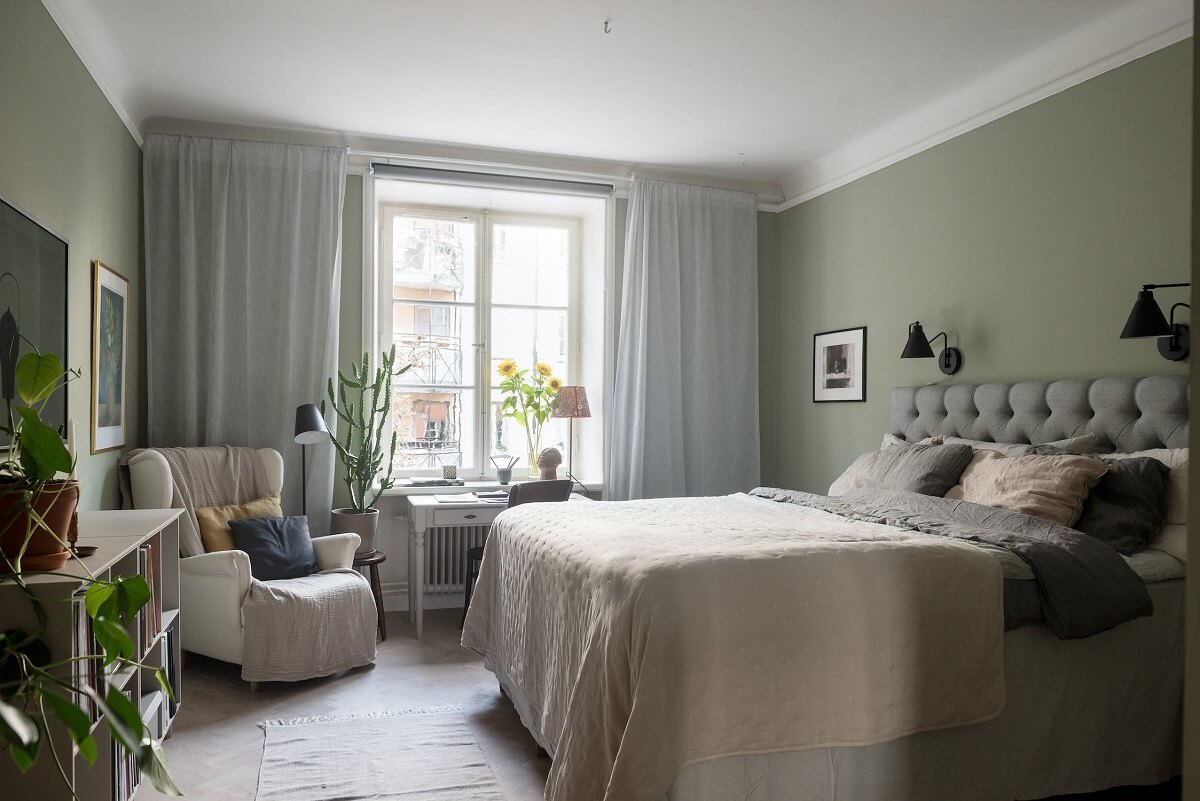 A Charming Open Plan Swedish Apartment 11 serene-bedroom-with-armchair-nordroom