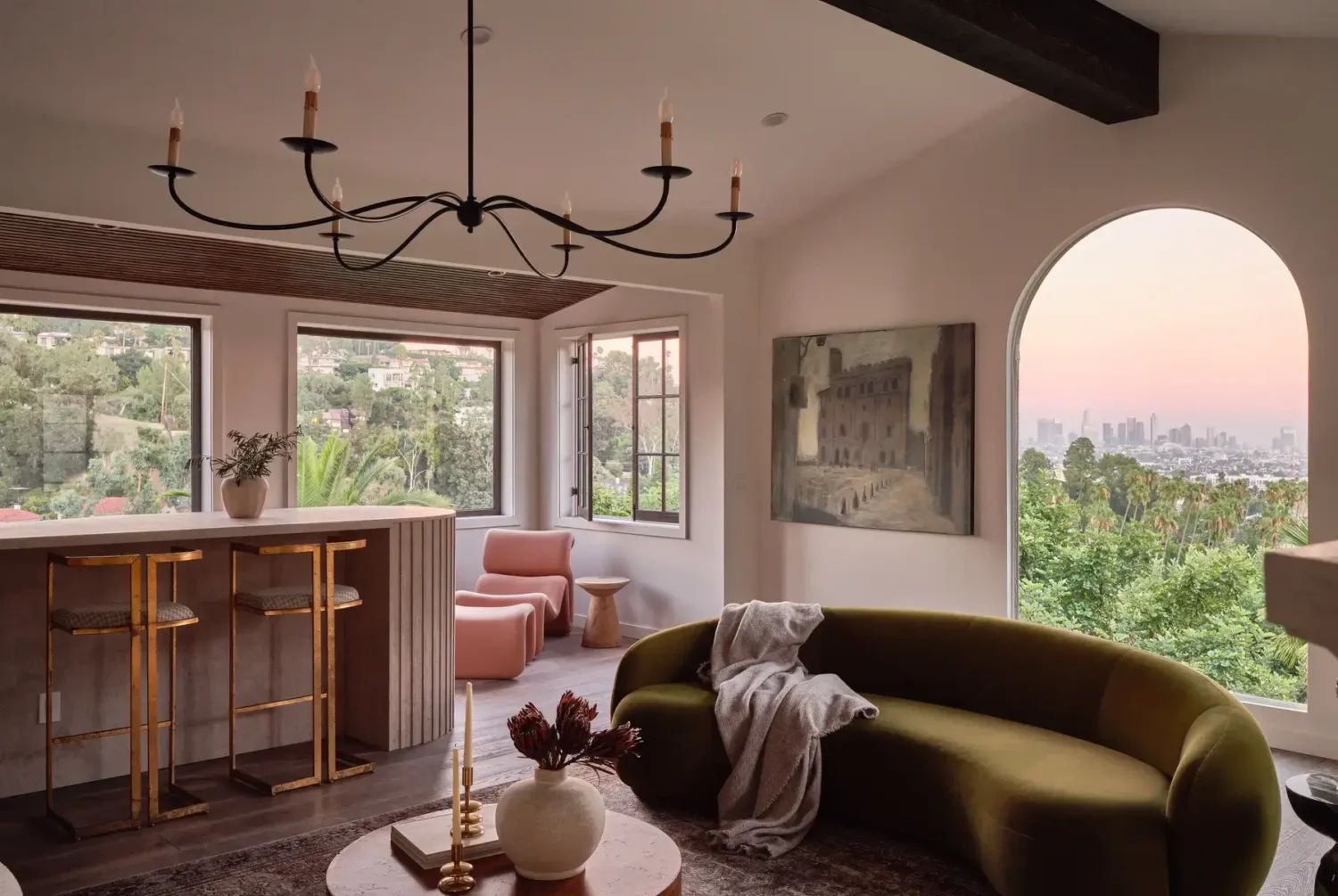 A Renovated Spanish Style Home in Hollywood Hills 8 sitting-room-home-bar-curved-green-sofa-arched-window-nordroom