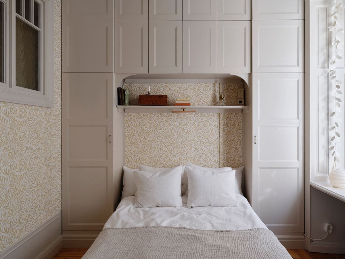 A Light Scandinavian Apartment with Classic Touches 12 small-bedroom-wallpaper-built-in-wardrobes-nordroom