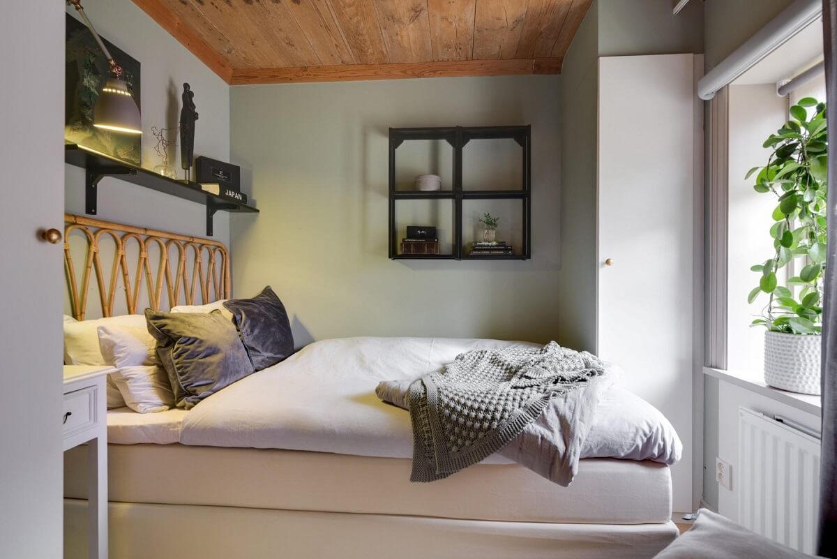 A Small 18th-Century Courtyard House in Sweden 11 small light gray bedroom wooden ceiling