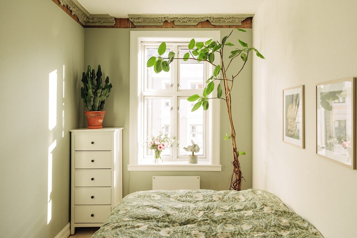 A Charming Norwegian Apartment with Wooden Walls 14 small-light-green-bedroom