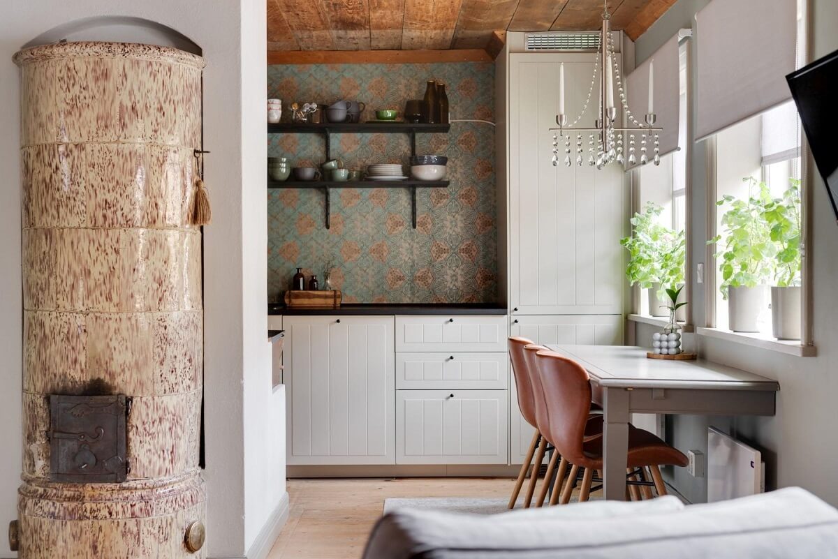 A Small 18th-Century Courtyard House in Sweden 7 small living room open kitchen white cabinets