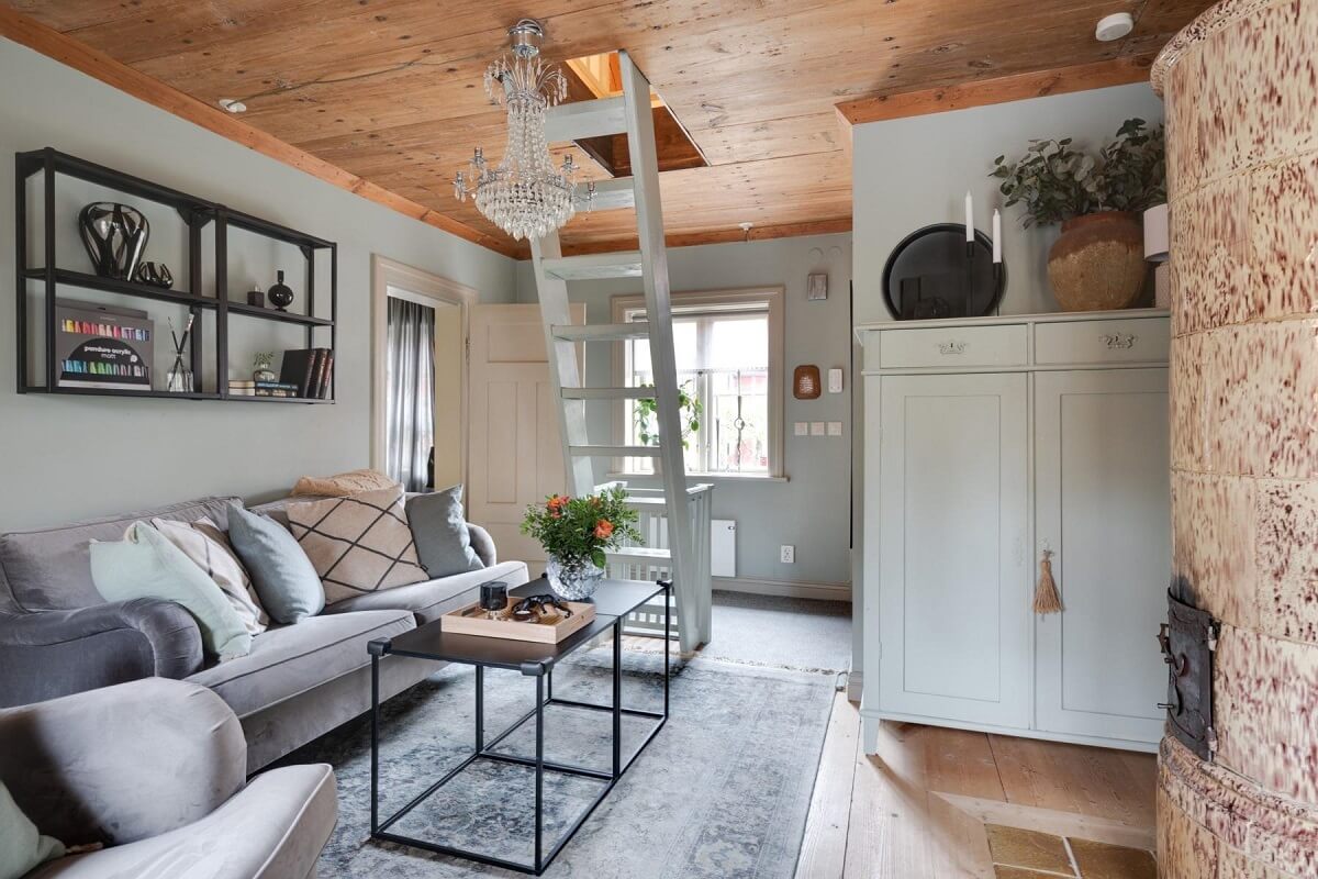 A Small 18th-Century Courtyard House in Sweden 1 small living room wooden ceiling fireplace