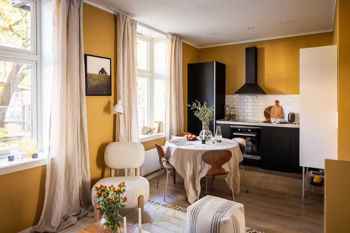 An Oslo Apartment with a Yellow Living Room 7 small-open-plan-living-space-yellow-walls-black-kitchen-nordroom