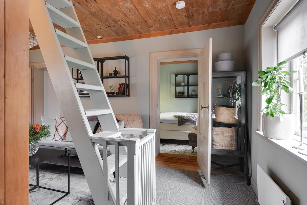 A Small 18th-Century Courtyard House in Sweden 10 tiny living room stairs woodenceiling