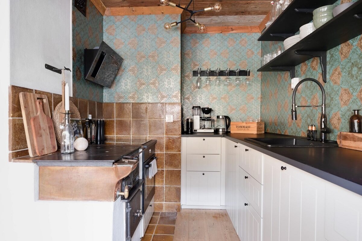 A Small 18th-Century Courtyard House in Sweden 8 white kitchen blue tiles