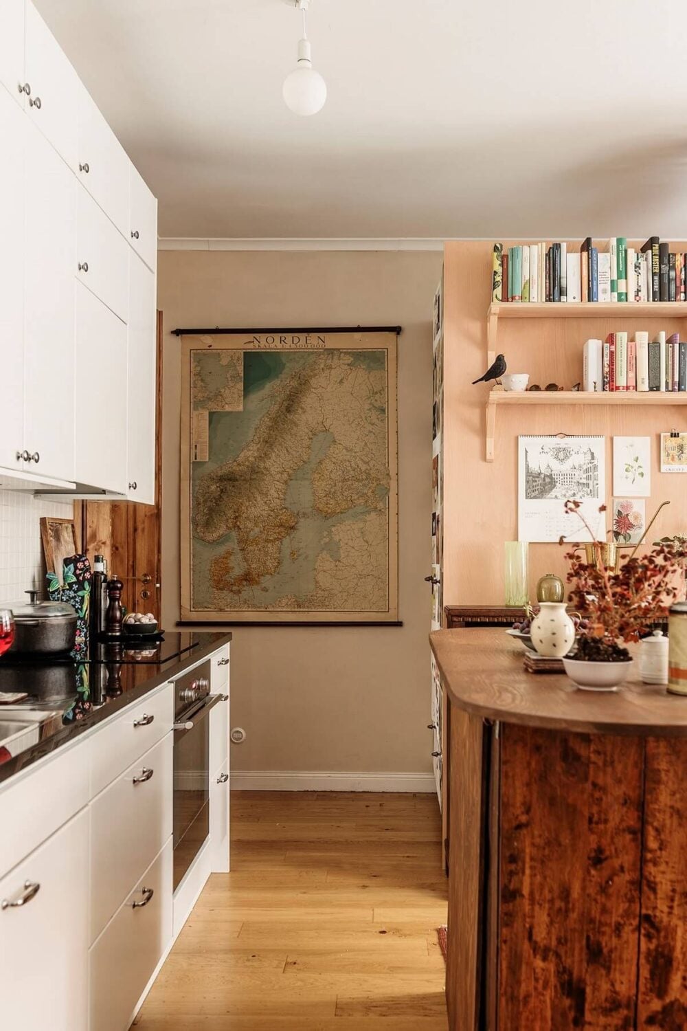 A Vintage Style Apartment in Stockholm 7 white-kitchen-with-wooden-island-nordroom