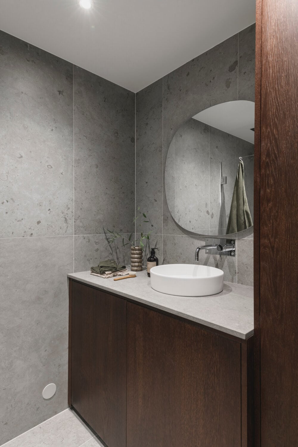 A Stylish Modern Gray Attic Apartment 21 wooden-vanity-bathroom-gray-tiles-nordroom