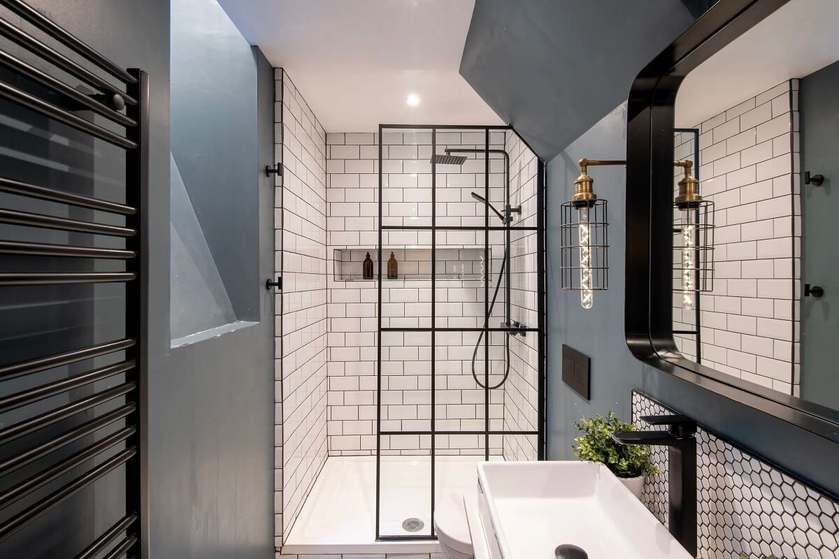 A Spacious and Stylish Houseboat in London 11 bathroom gray walls white tiles black fittings nordroom