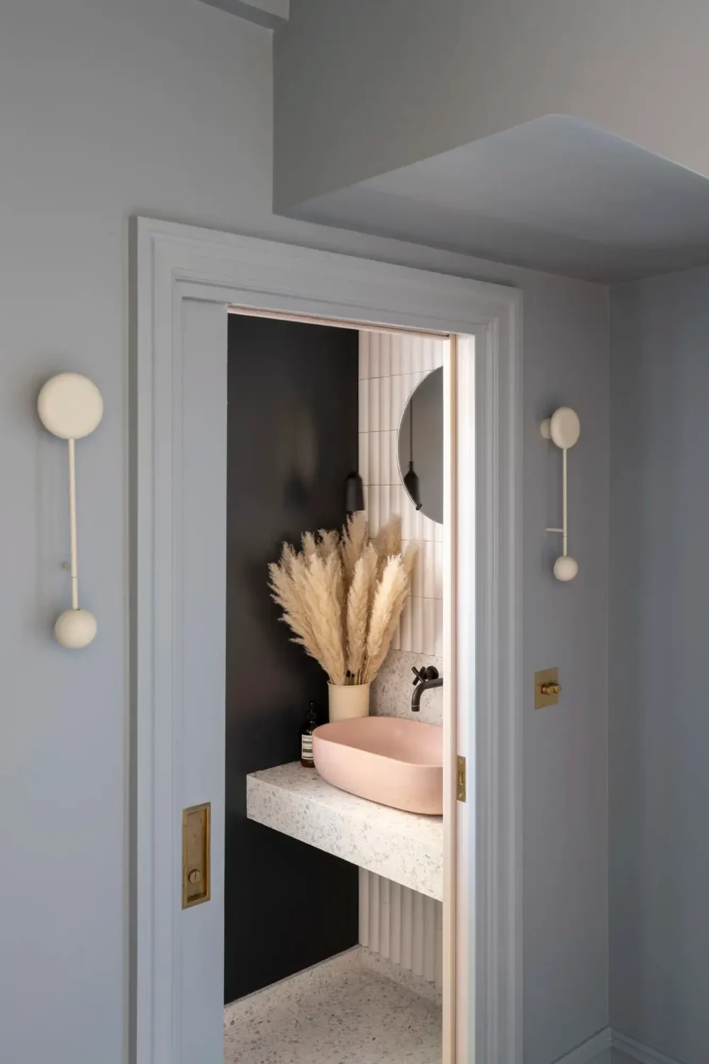 An Award-Winning Apartment with Color Accents in Notting Hill 10 bathroom-pink-sink-nordroom