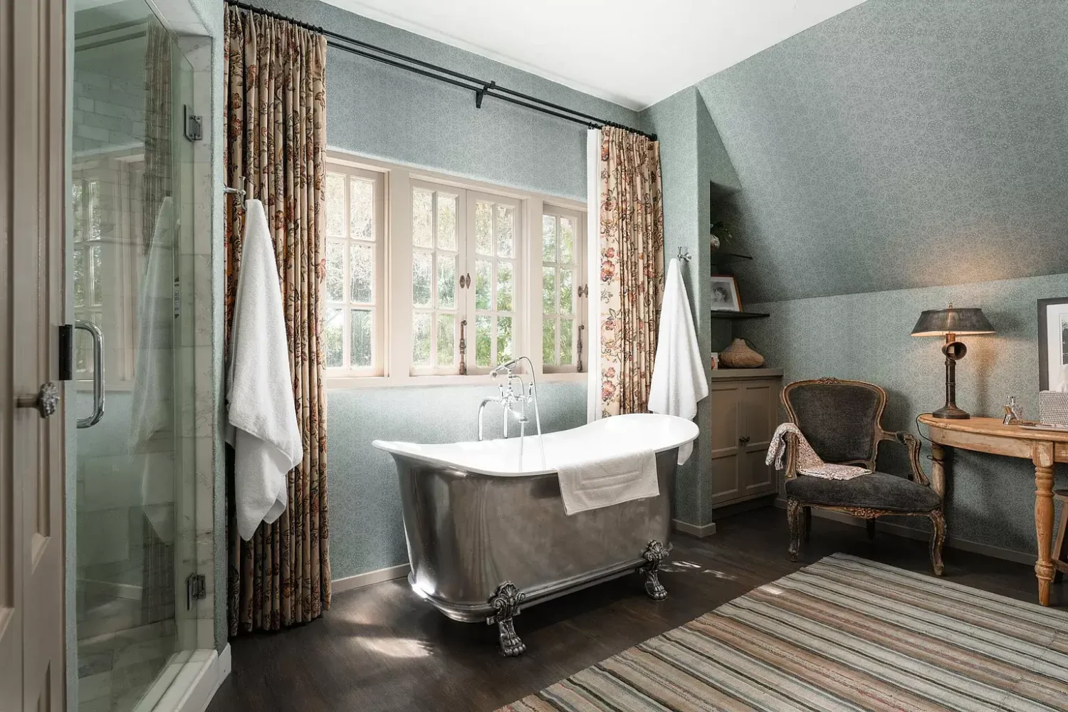A Cozy Montecito Home Once Owned by Larry David 14 bathroom-slanted-ceiling-blue-walls-freestanding-bath