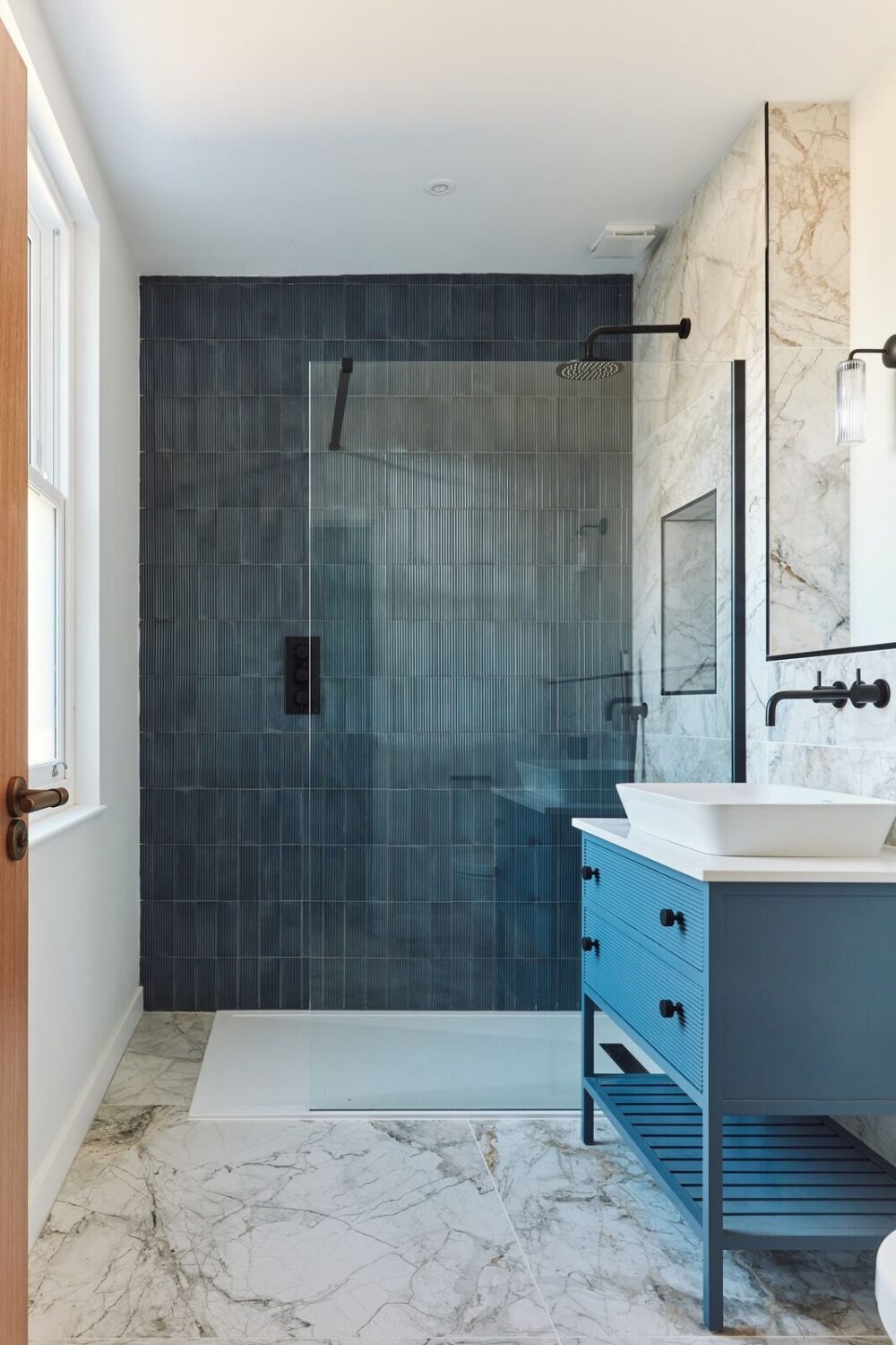 A Converted 19th Century Chapel in Bath 19 bathroom-walk-in-shower-blue-tiles-vanity-nordroom