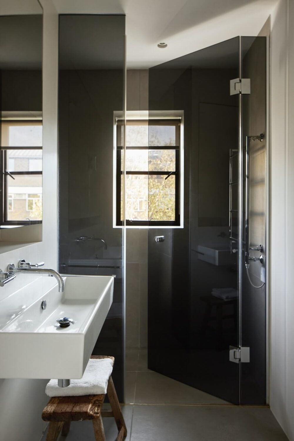Stylish Monochrome Interiors in an Early 20th Century House 23 bathroom-with-shower-black-doors-nordroom
