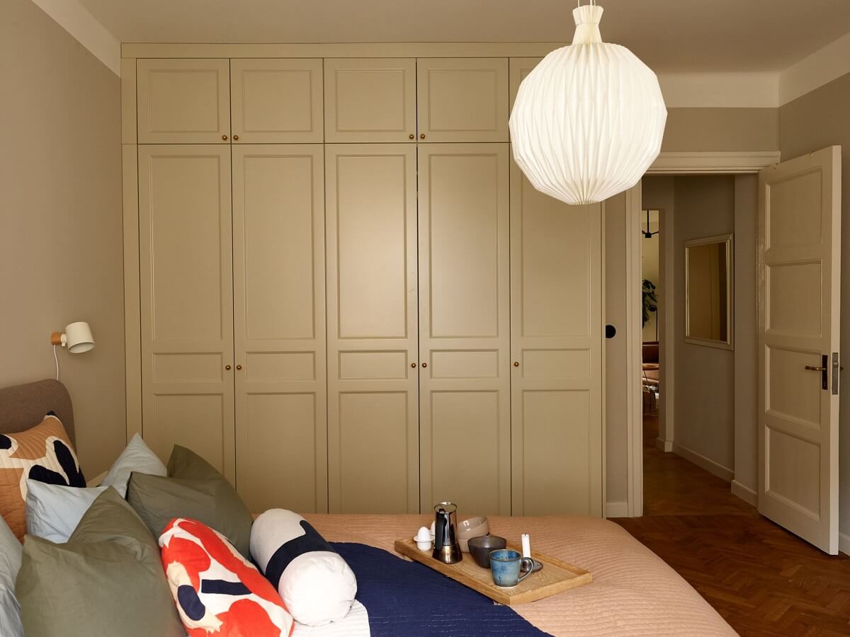 A Serene Light Colored Apartment with Bright Color Pops 17 bedroom built in wardrobes colorful bedding