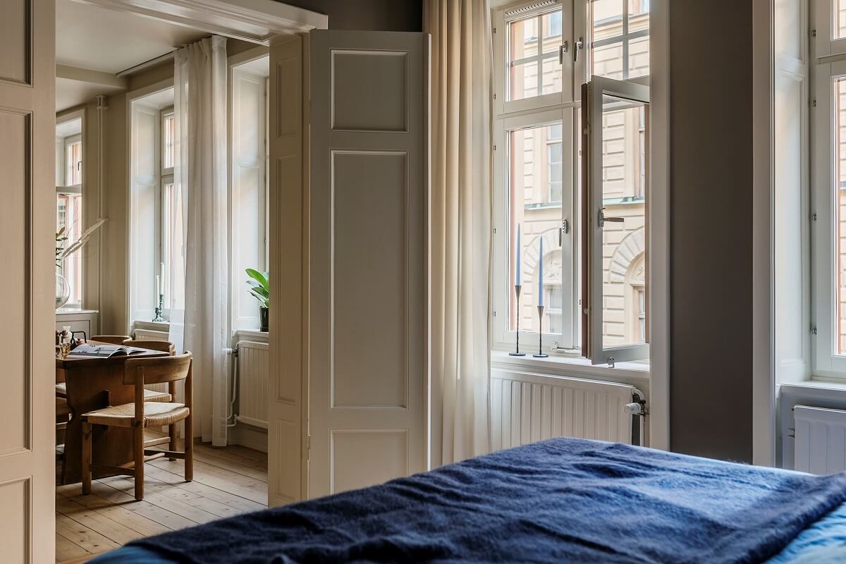 A Cozy Scandinavian Apartment with a Cobalt Color Accent 16 bedroom double wooden doors