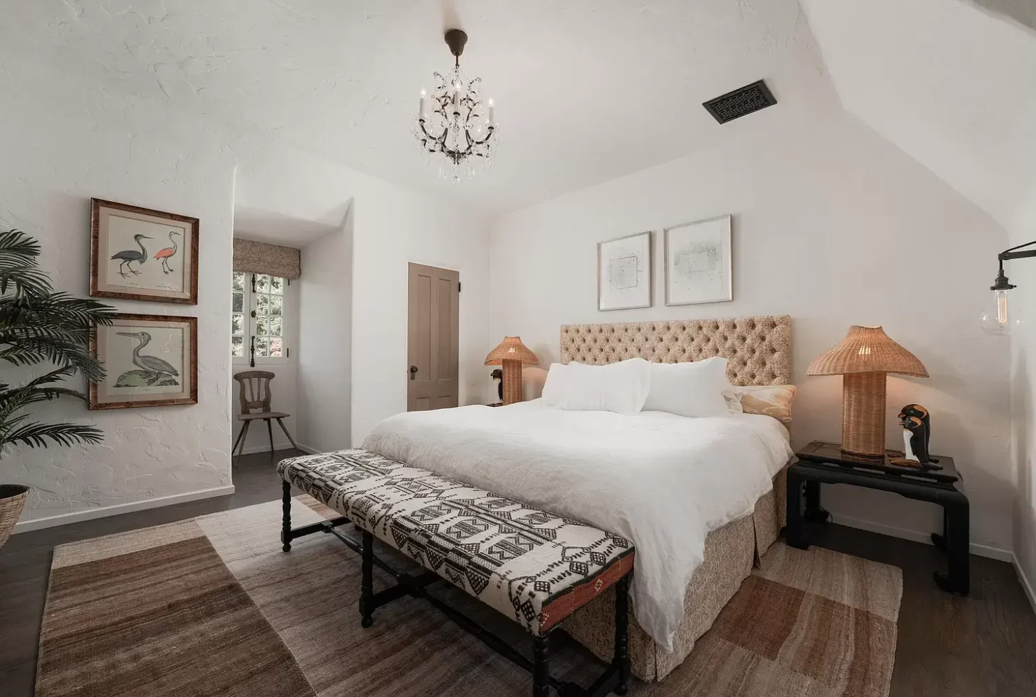 A Cozy Montecito Home Once Owned by Larry David 17 bedroom-slanted-ceiling-rug-nordroom