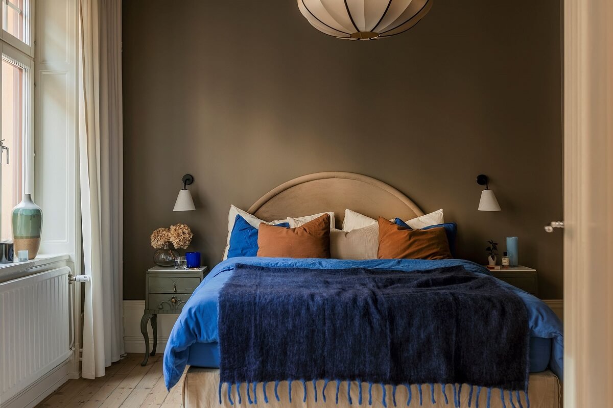 A Cozy Scandinavian Apartment with a Cobalt Color Accent 14 bedroom with cobalt blue bedding
