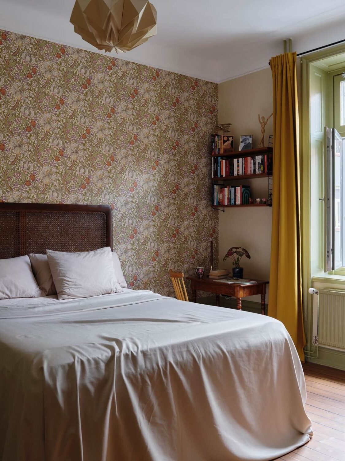 A Scandi Apartment Mixes Vintage with Contemporary Design 12 bedroom-wooden-headboard-wallpaper-desk-ochre-curtains-nordroom