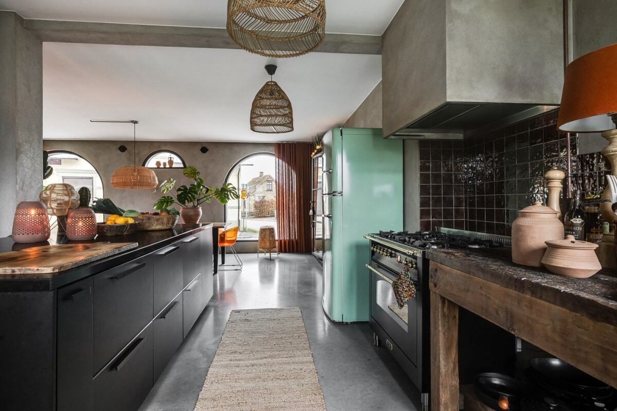 A Unique Bohemian Family Home in a Former Swedish Bakery 12 black-kitchen-mint-green-smeg-fridge-nordroom