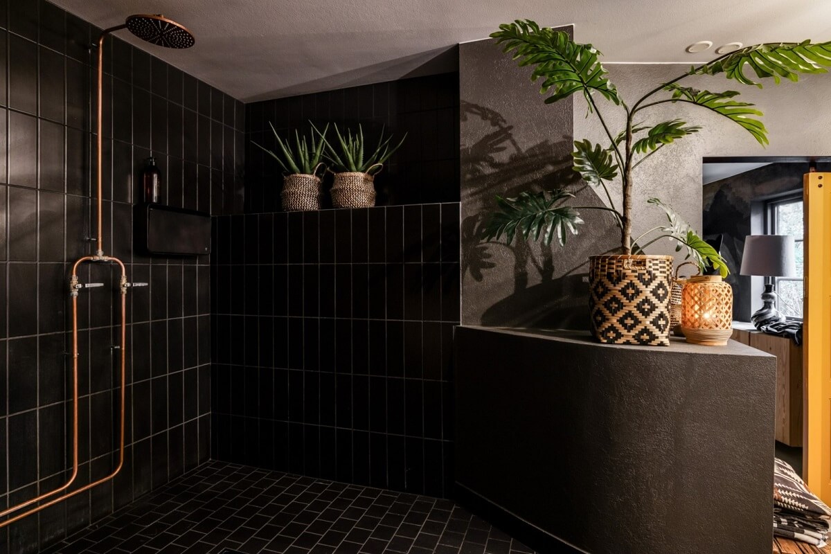A Unique Bohemian Family Home in a Former Swedish Bakery 28 black-tiled-bathroom-with-shower-nordroom