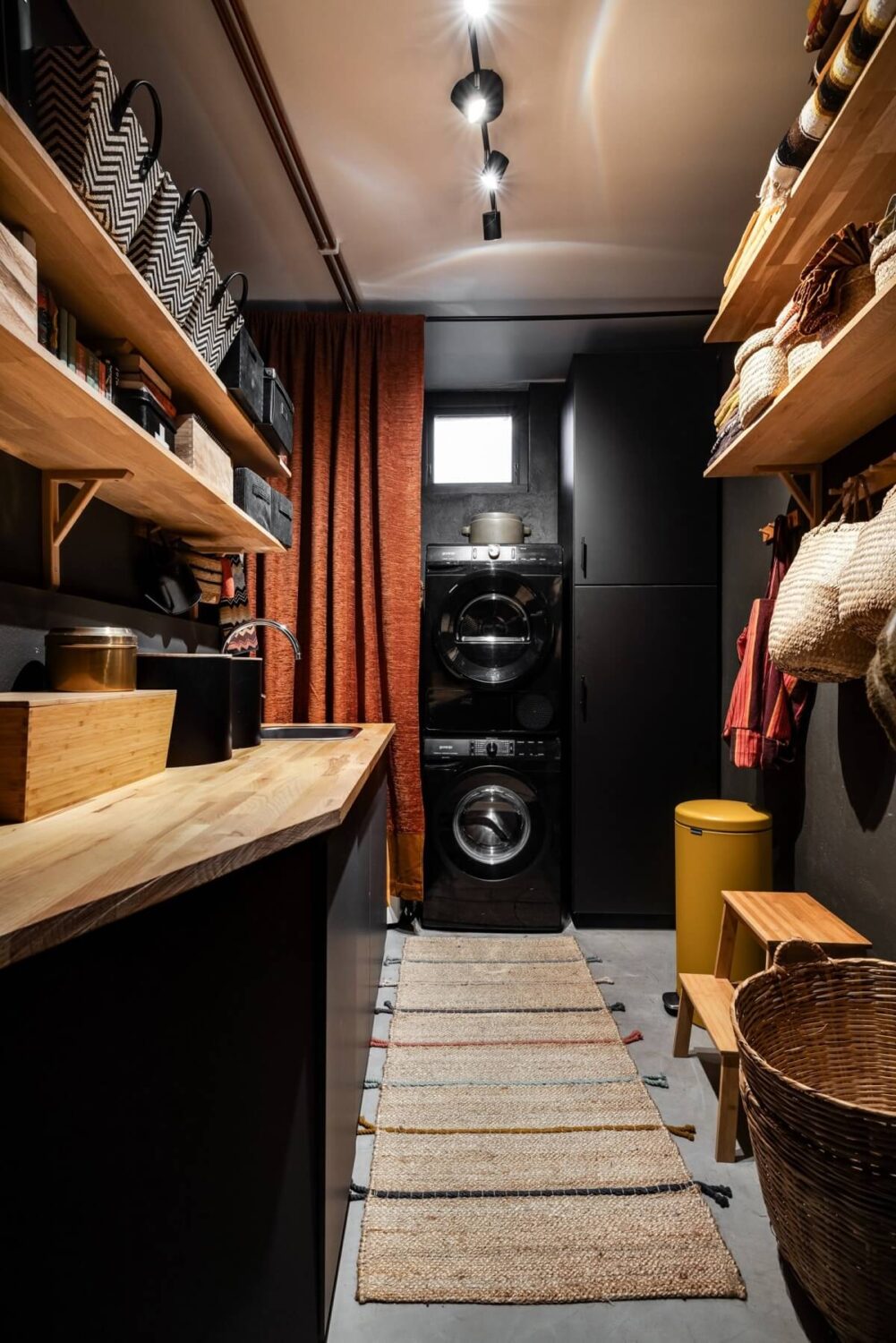 A Unique Bohemian Family Home in a Former Swedish Bakery 24 black-utility-room-wooden-shelves-nordroom
