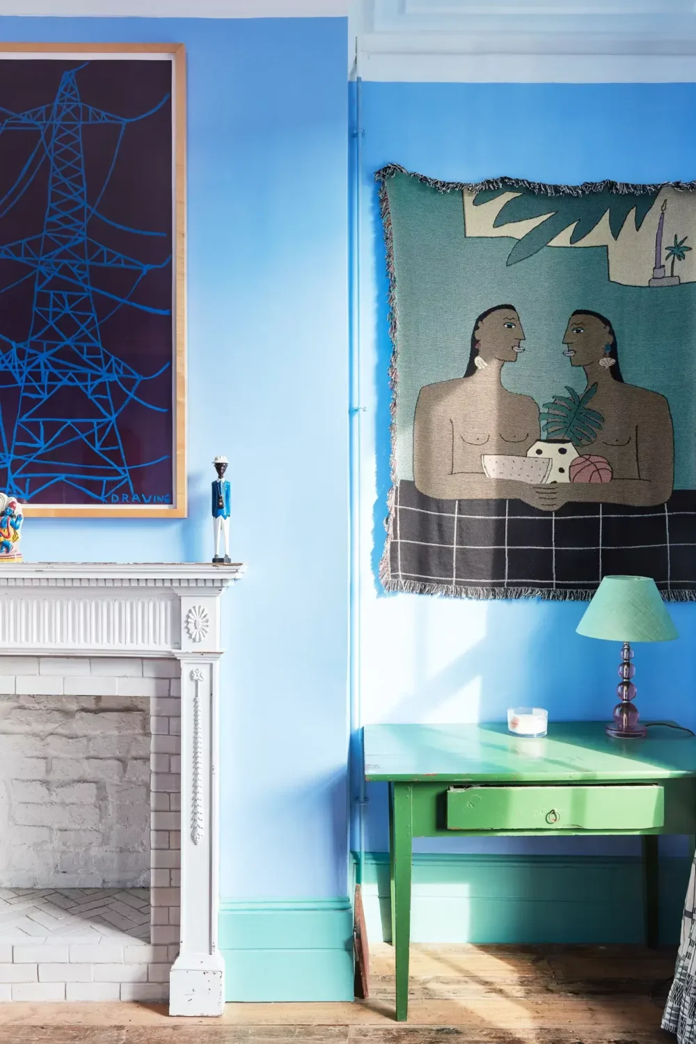 A Playful Colorful Eclectic Artist Home in London 19 blue bedroom fireplace detail