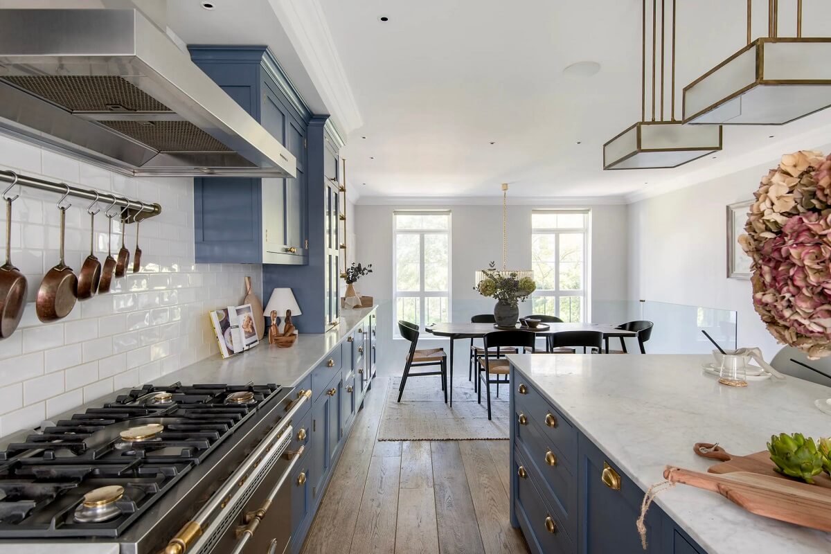 Muted Colors and Classic Design in a London Townhouse 9 blue-kitchen-with-island-wooden-floor-nordroom