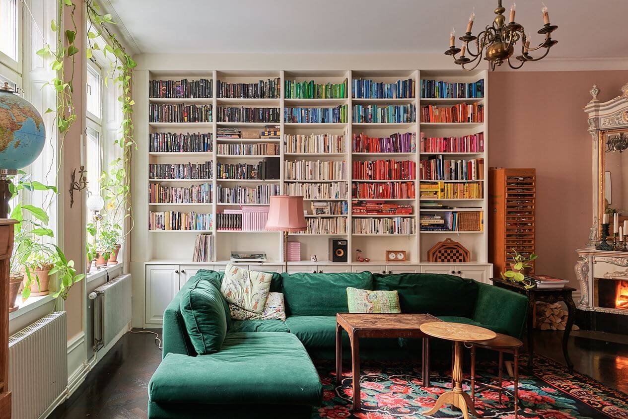 A Romantic Apartment with Original Details 3 bookshelves-pink-walls-green-sofa-nordroom