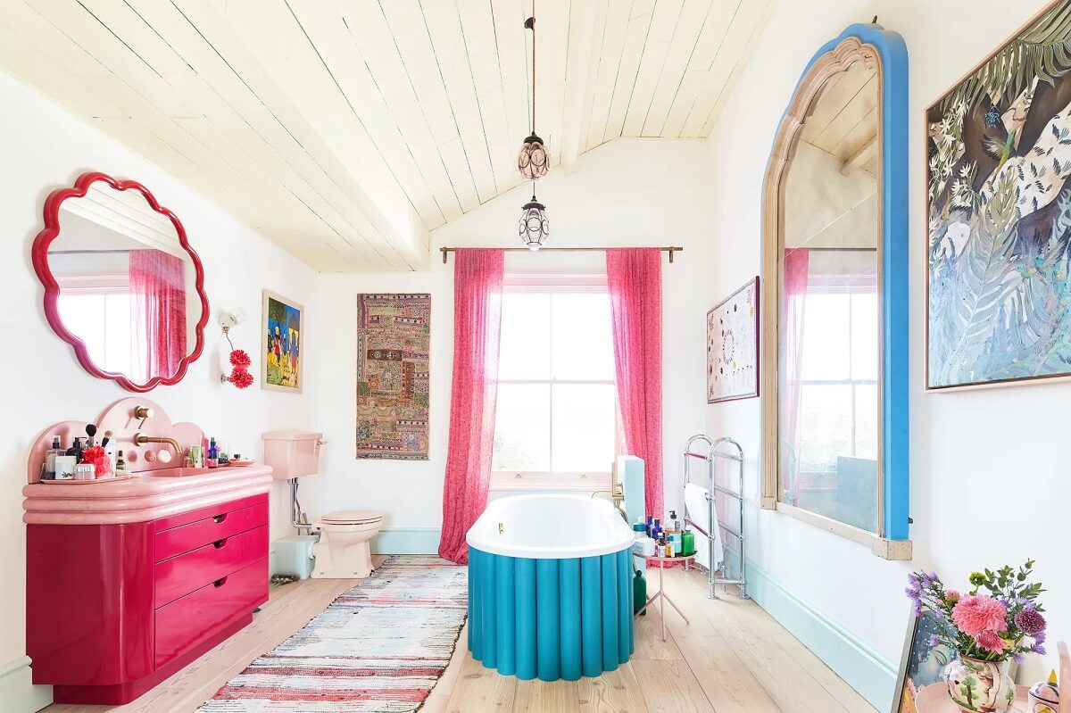 A Playful Colorful Eclectic Artist Home in London 20 colorful bathroom pink vanity blue bath