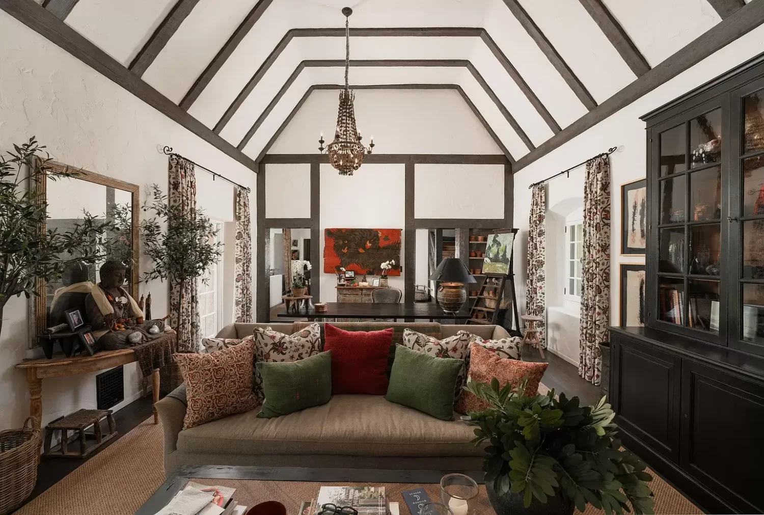 A Cozy Montecito Home Once Owned by Larry David 2 cozy-living-room-slanted-ceiling-wooden-beams