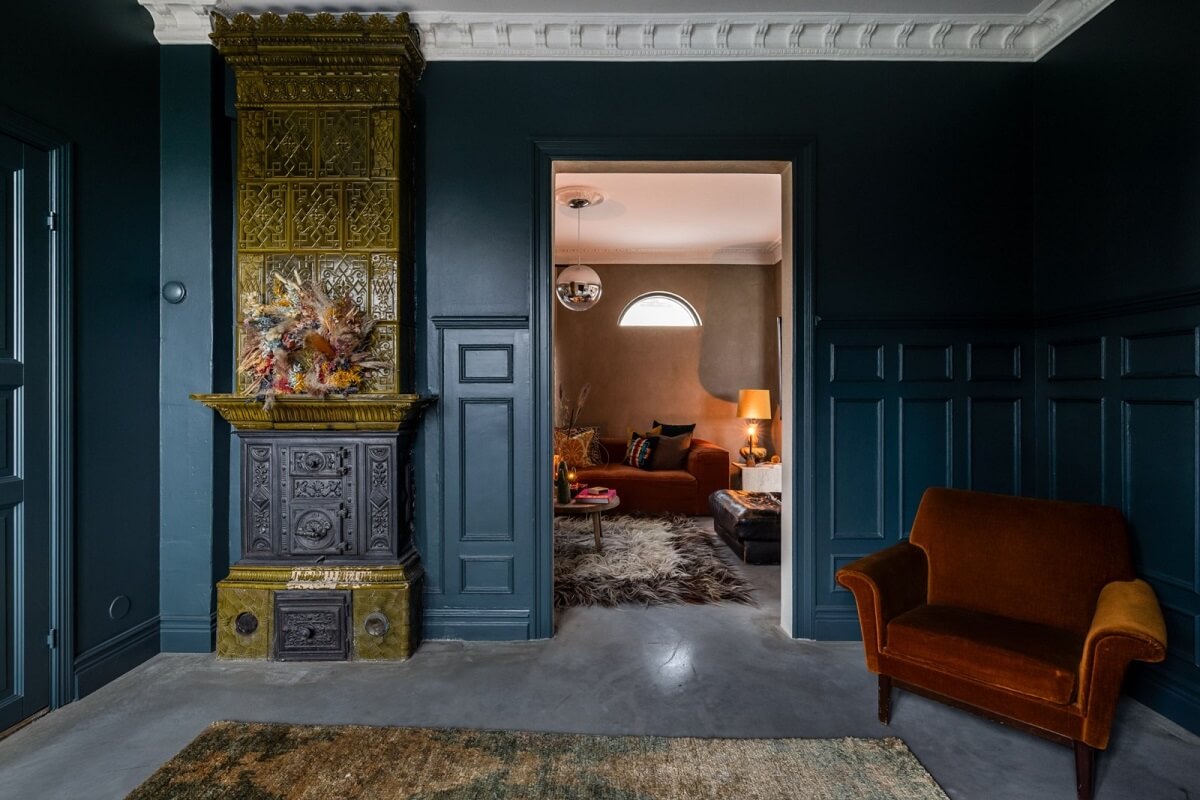 A Unique Bohemian Family Home in a Former Swedish Bakery 6 dark-blue-home-office-green-fireplace-nordroom