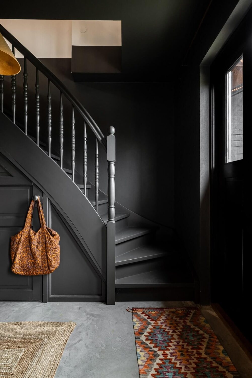 A Unique Bohemian Family Home in a Former Swedish Bakery 21 dark-gray-hallway-staircase-nordroom
