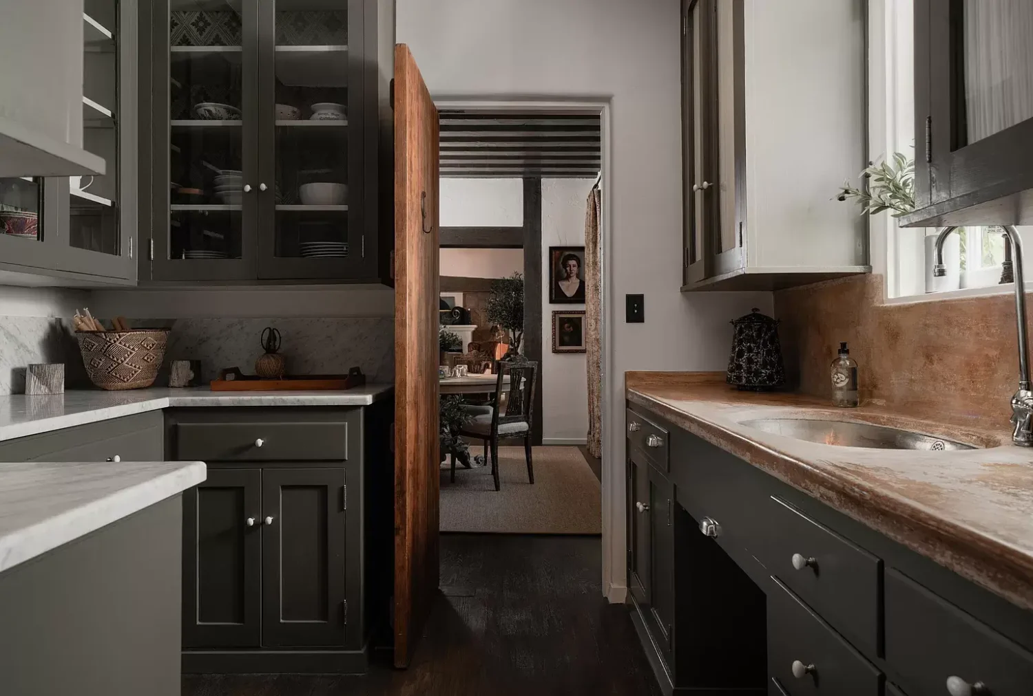 A Cozy Montecito Home Once Owned by Larry David 7 dark-gray-pantry-utility-room