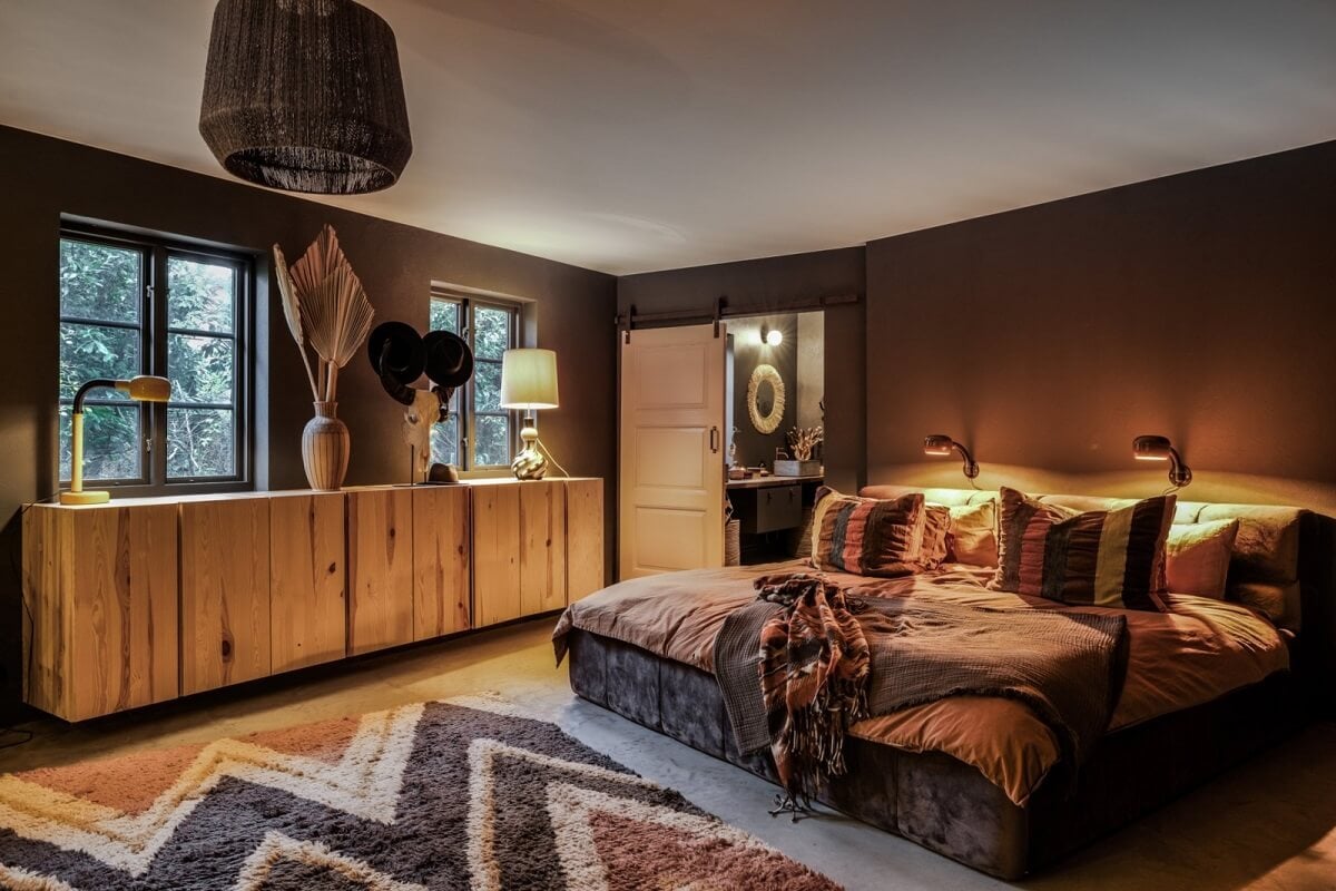 A Unique Bohemian Family Home in a Former Swedish Bakery 26 dark-walls-bohemian-bedroom-layered-textiles-nordroom