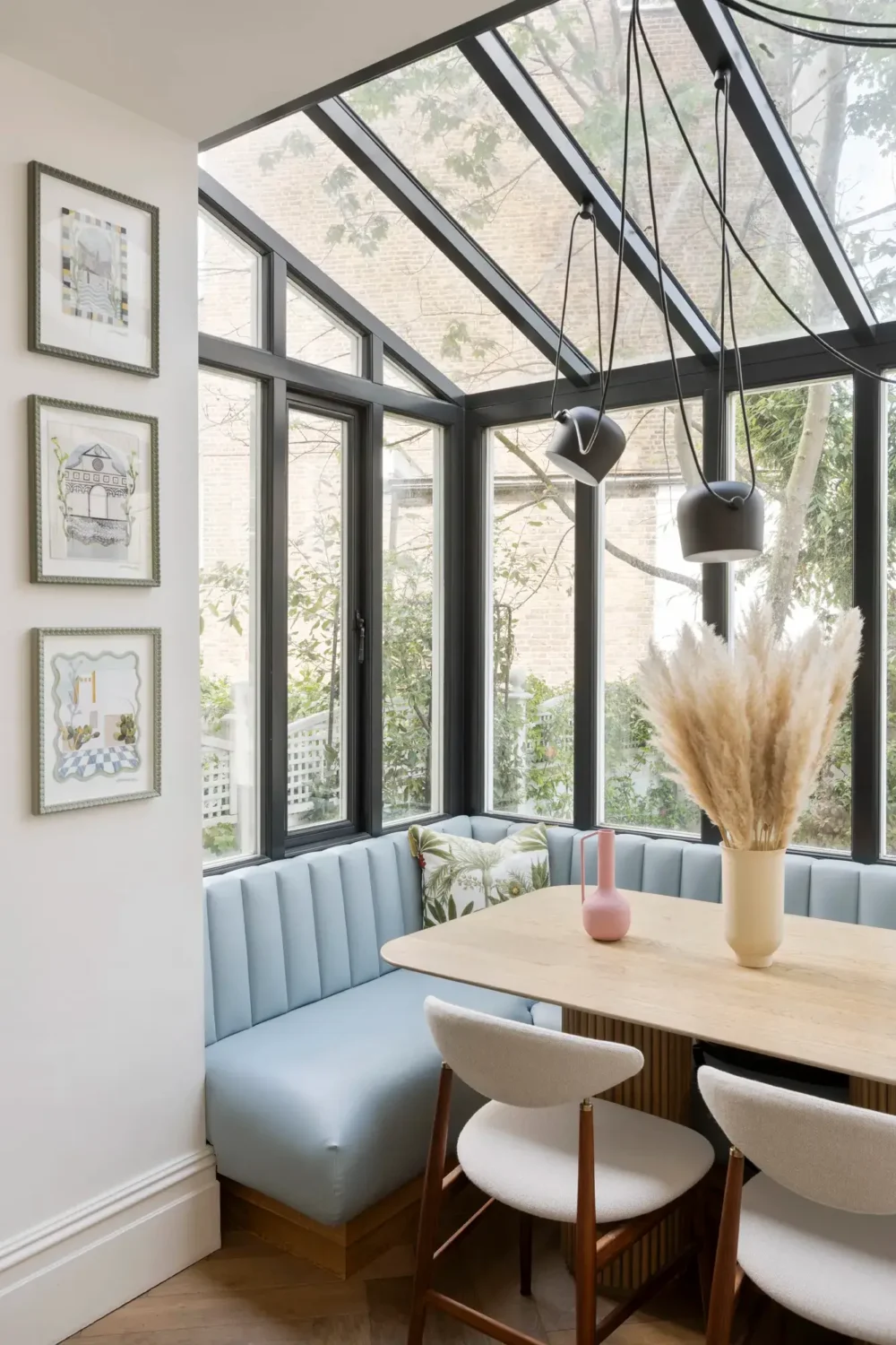 An Award-Winning Apartment with Color Accents in Notting Hill 9 dining-nook-blue-built-in-bench-skylight-nordroom