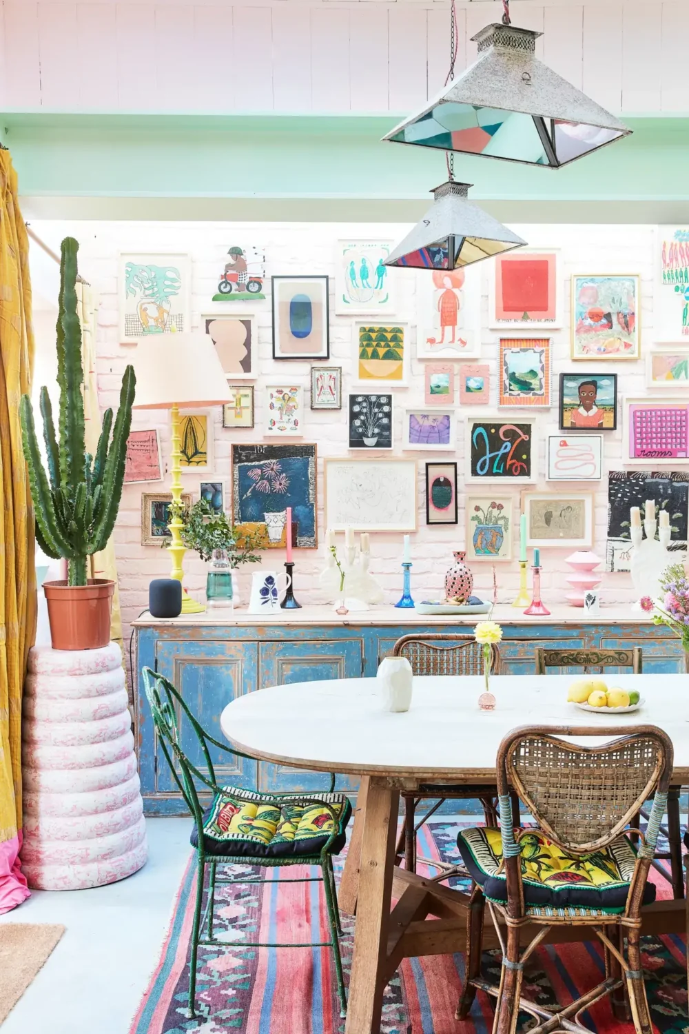 A Playful Colorful Eclectic Artist Home in London 6 dining space gallery wall