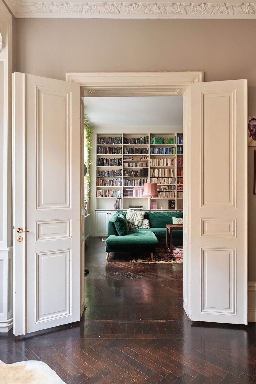 A Romantic Apartment with Original Details 8 double-doors-dark-wooden-floor-living-room