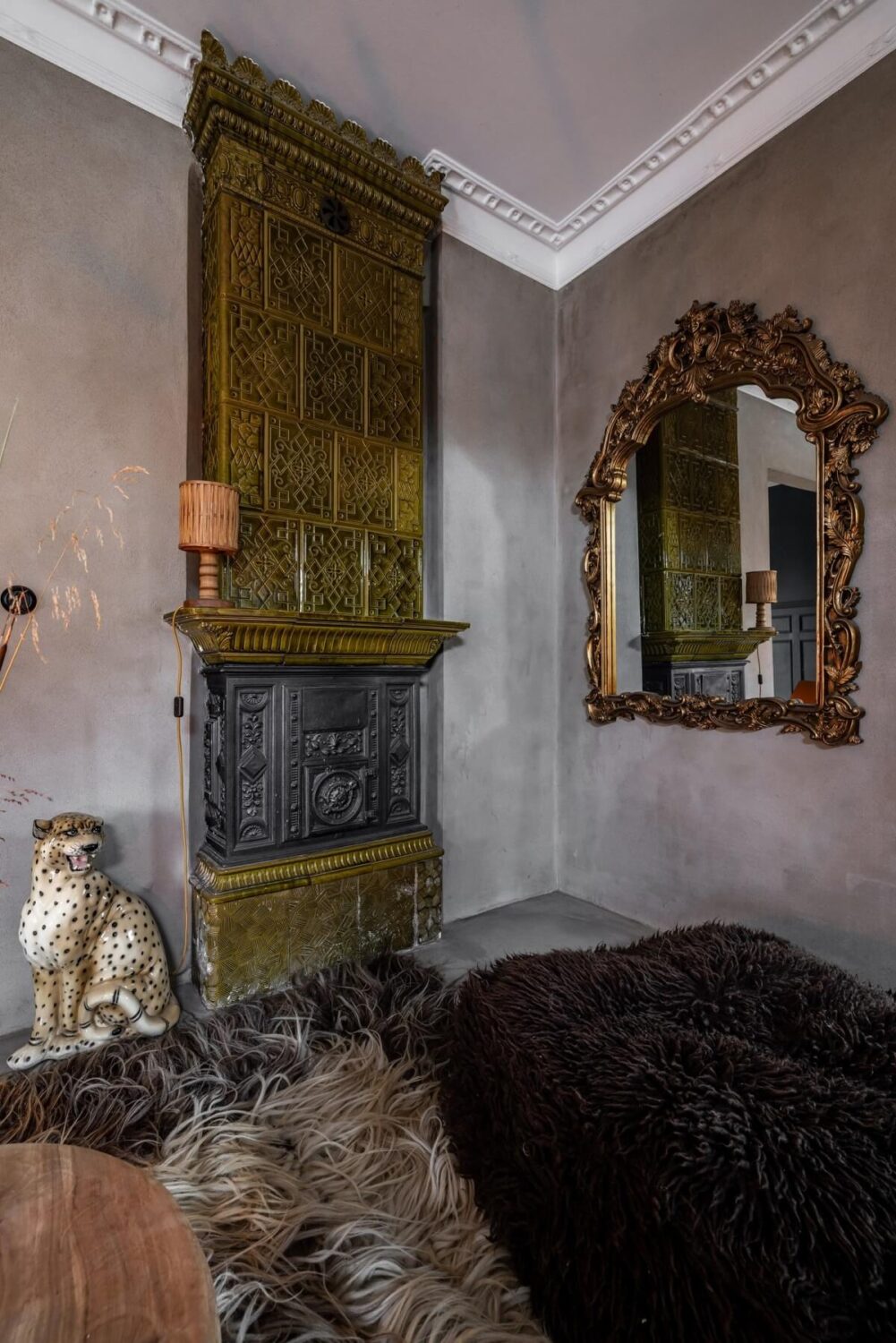 A Unique Bohemian Family Home in a Former Swedish Bakery 3 green-fireplace-living-room