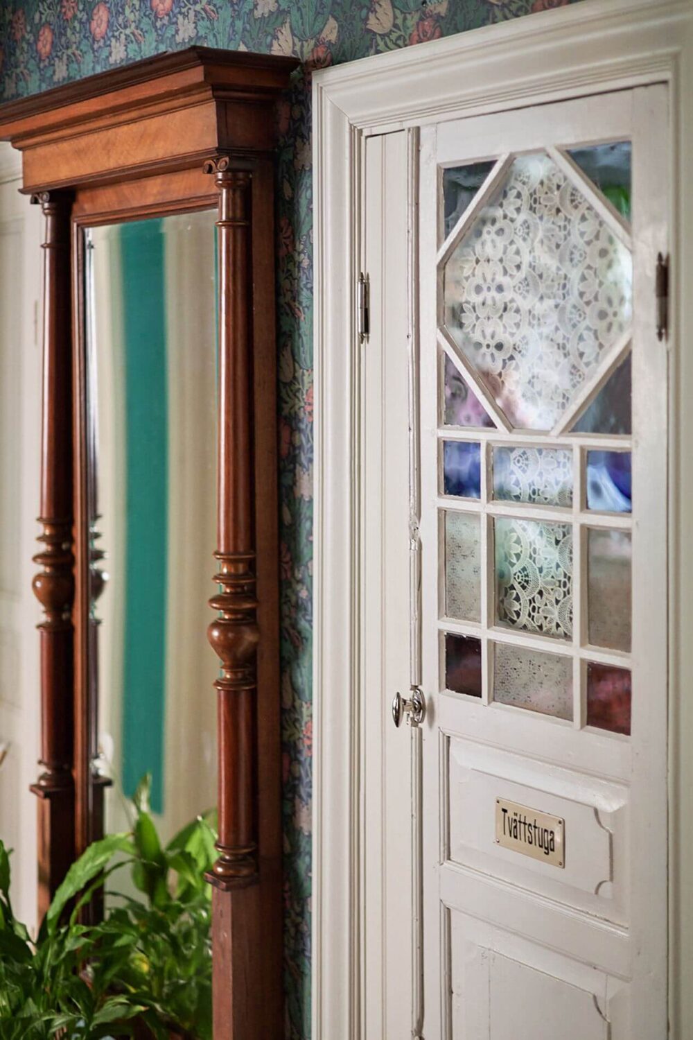 A Romantic Apartment with Original Details 11 hallway-antique-mirror-door-detail