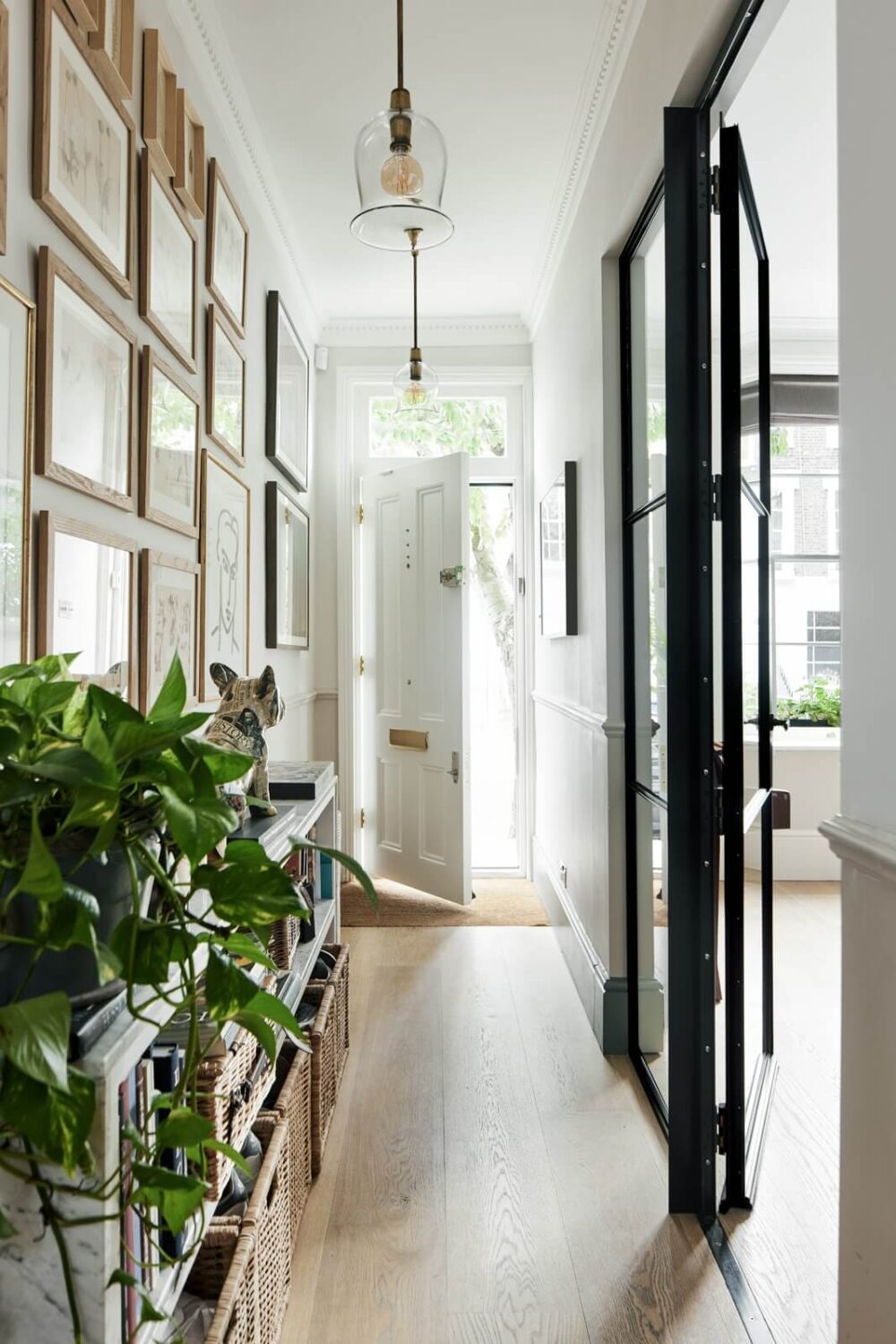 Blue Color Accents in a Restored London Townhouse 16 hallway-gallery-wall-industrial-steel-glass-door-nordroom