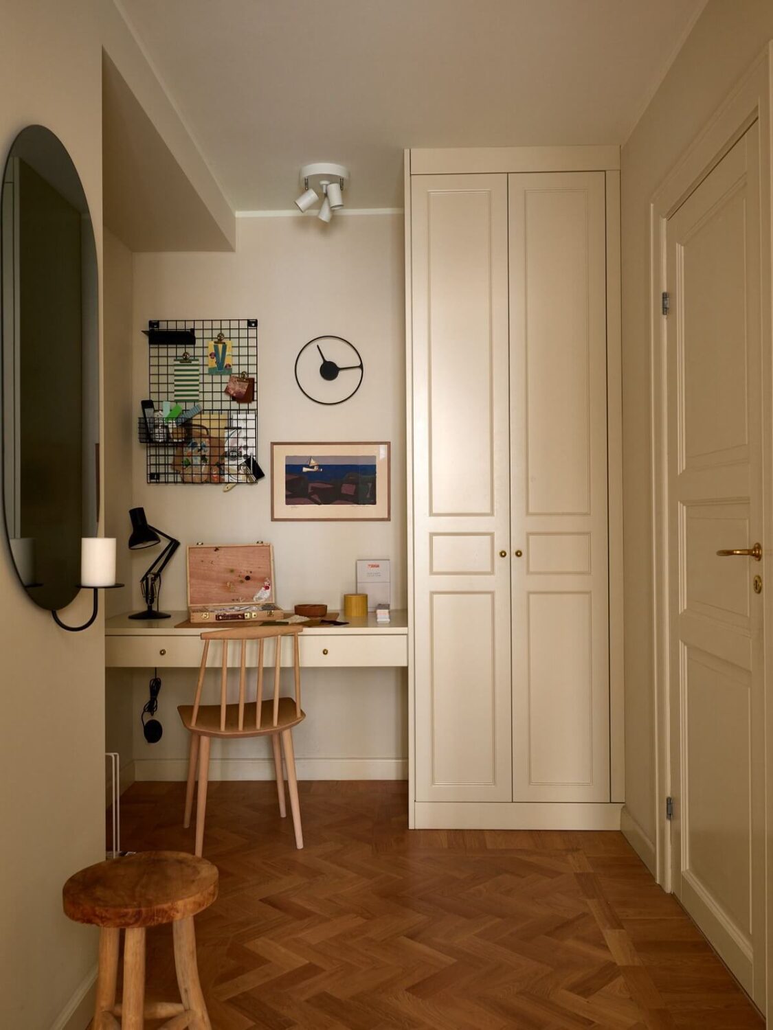 A Serene Light Colored Apartment with Bright Color Pops 12 home office built in desk cabinets