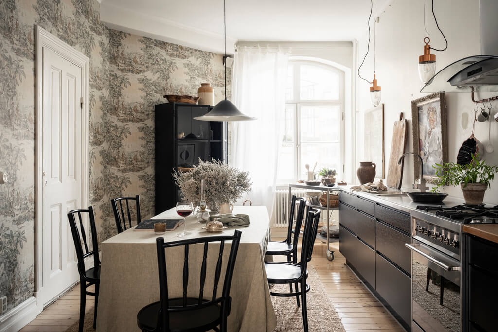 A Scandinavian Studio Apartment with Black Walls 16 kitchen black cabinets wallpaper