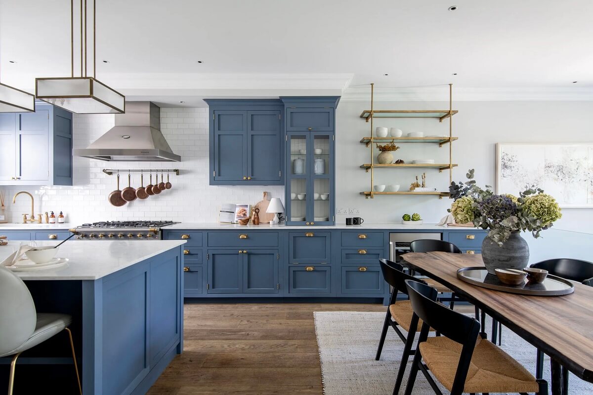 Muted Colors and Classic Design in a London Townhouse 8 kitchen-blue-cabinets-brass-handles-nordroom