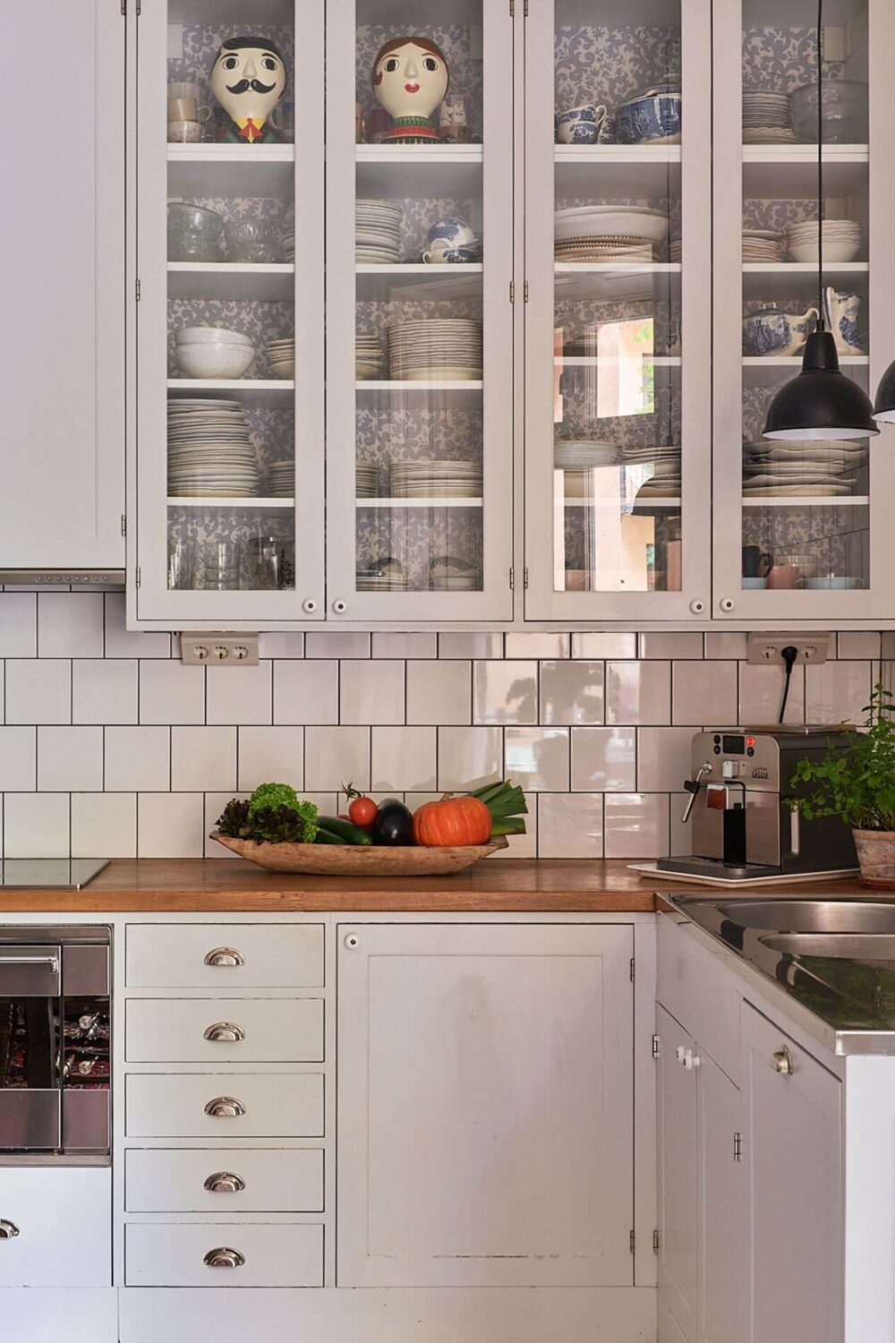 A Romantic Apartment with Original Details 19 kitchen-glass-upper-cabinets