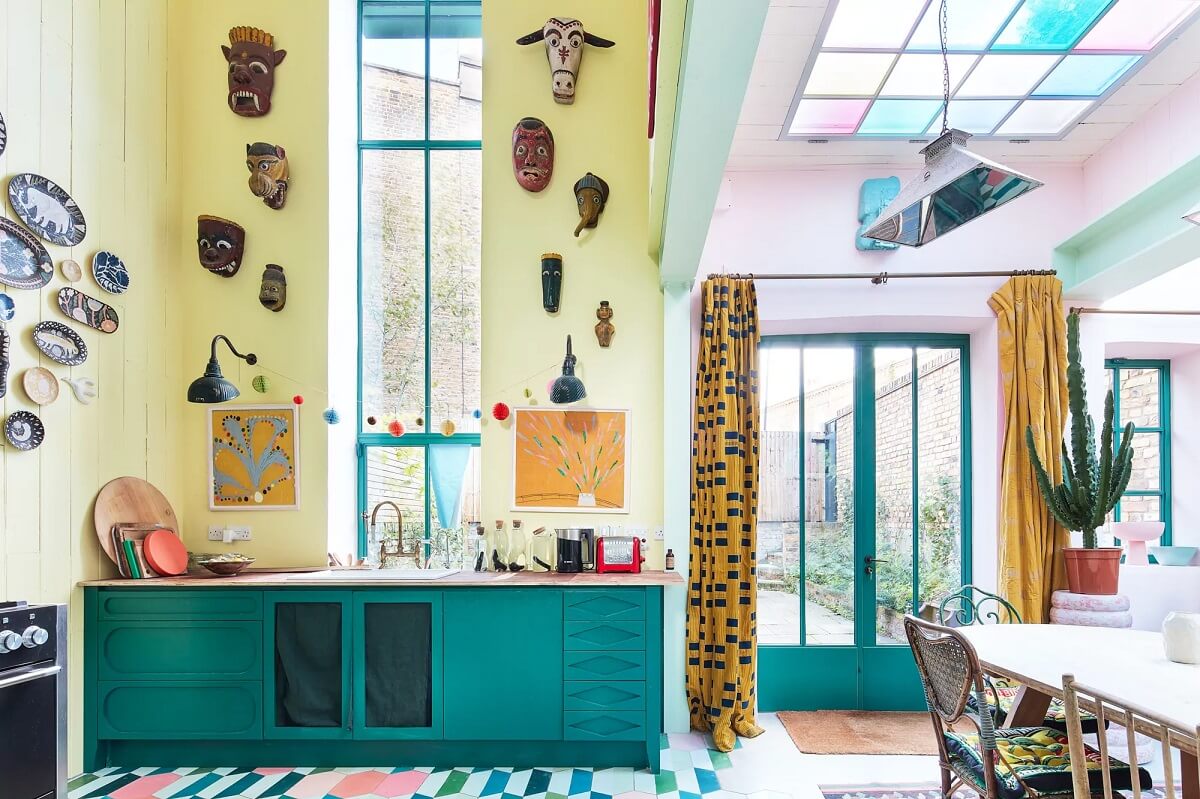 A Playful Colorful Eclectic Artist Home in London 4 kitchen high ceilings green kitchens yellow walls