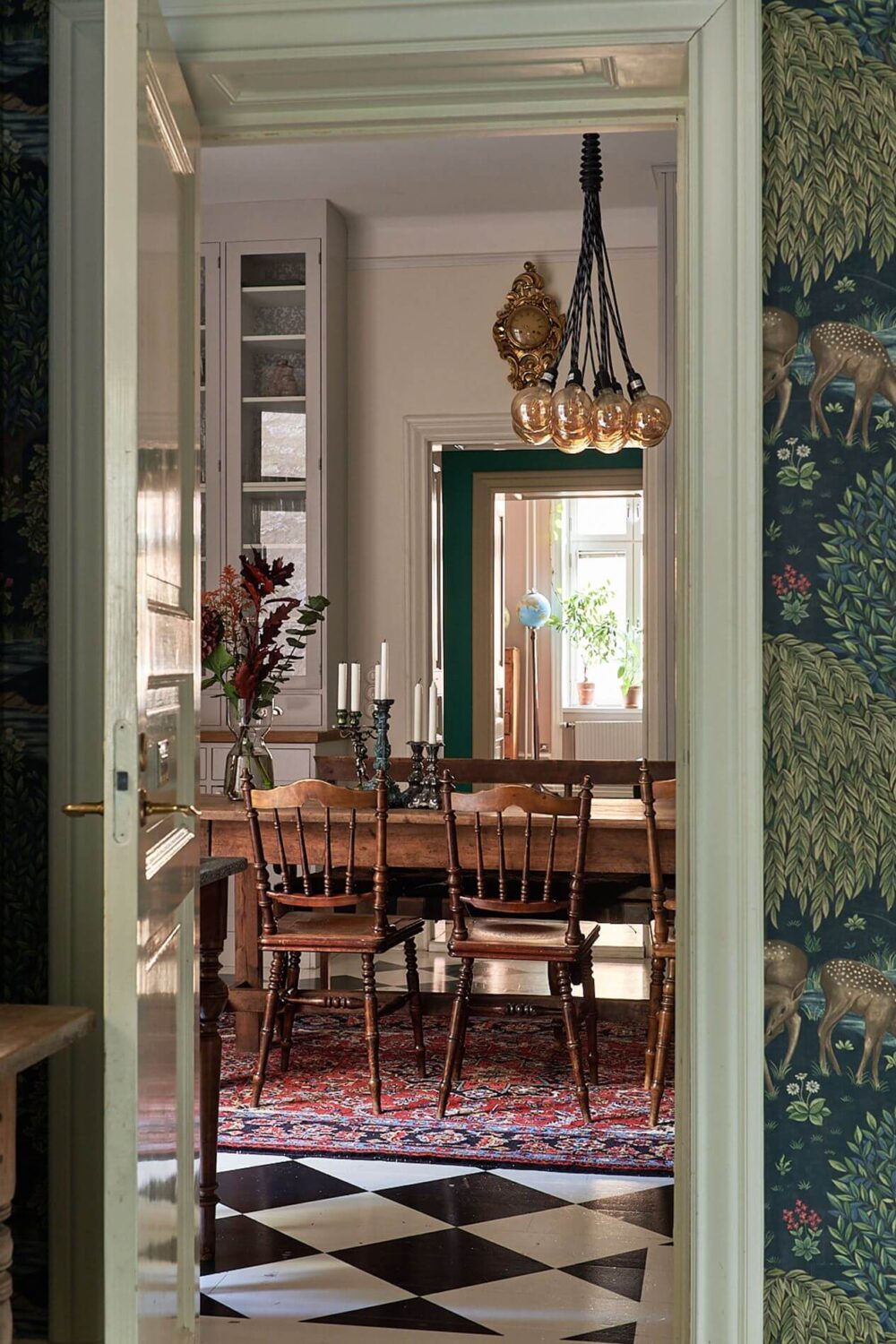 A Romantic Apartment with Original Details 14 kitchen-view-rustic-wooden-dining-table-checkerboard-floor-nordroom